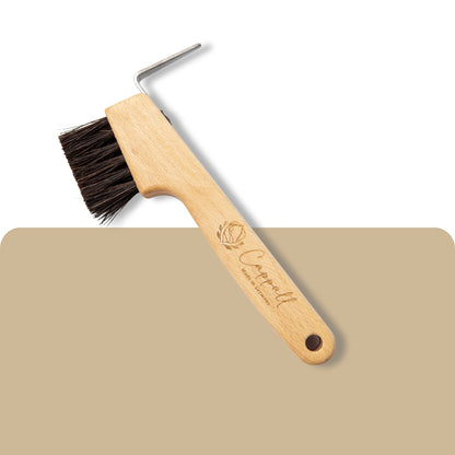 Wooden_hoof_pick_with_brush_cappall